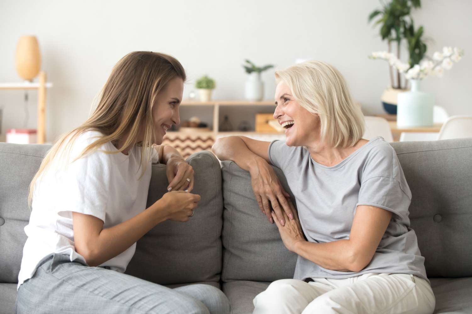 Laughing middle-aged woman with her adult daughter
