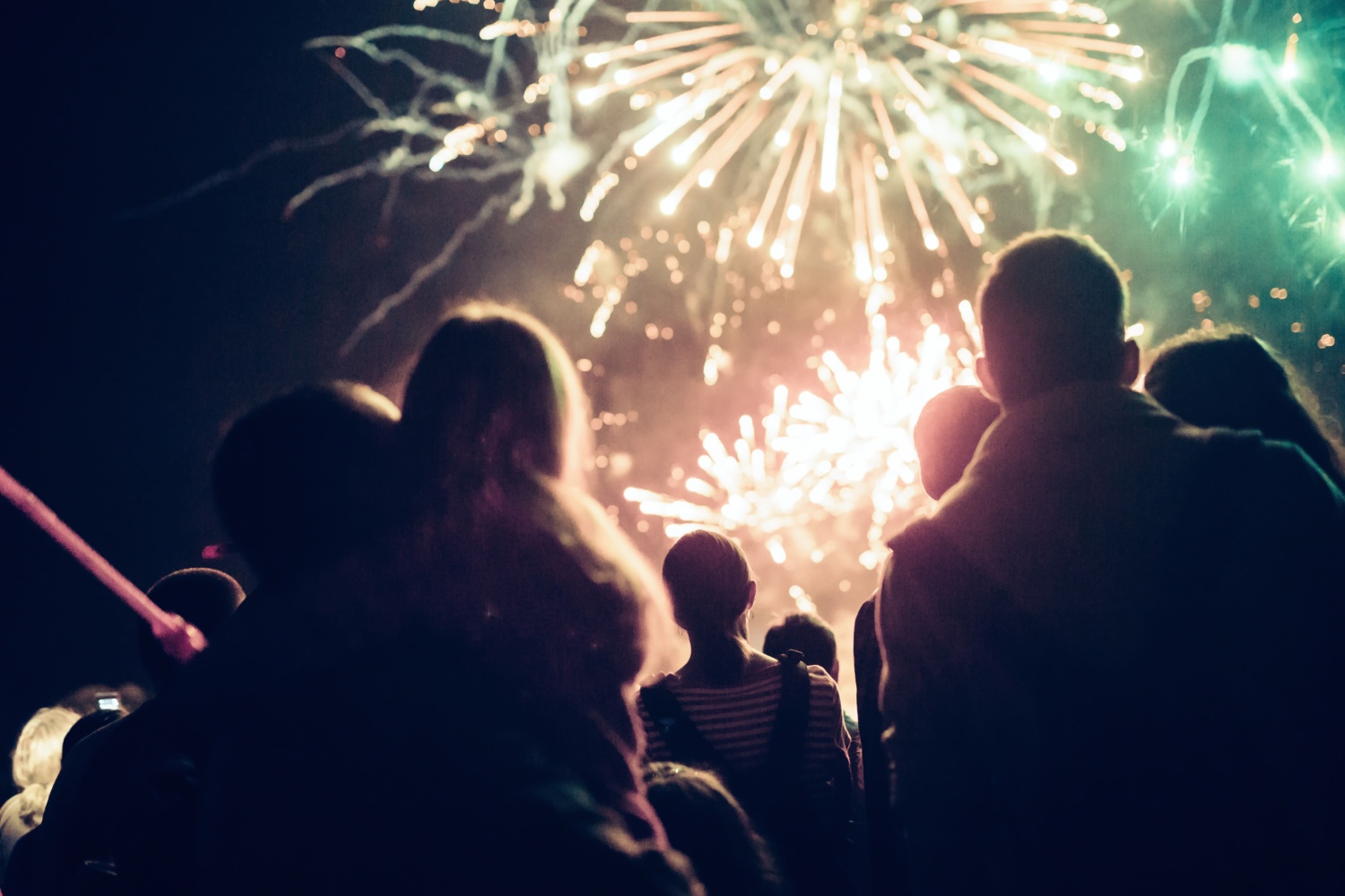 Crowd of people watching a firework display