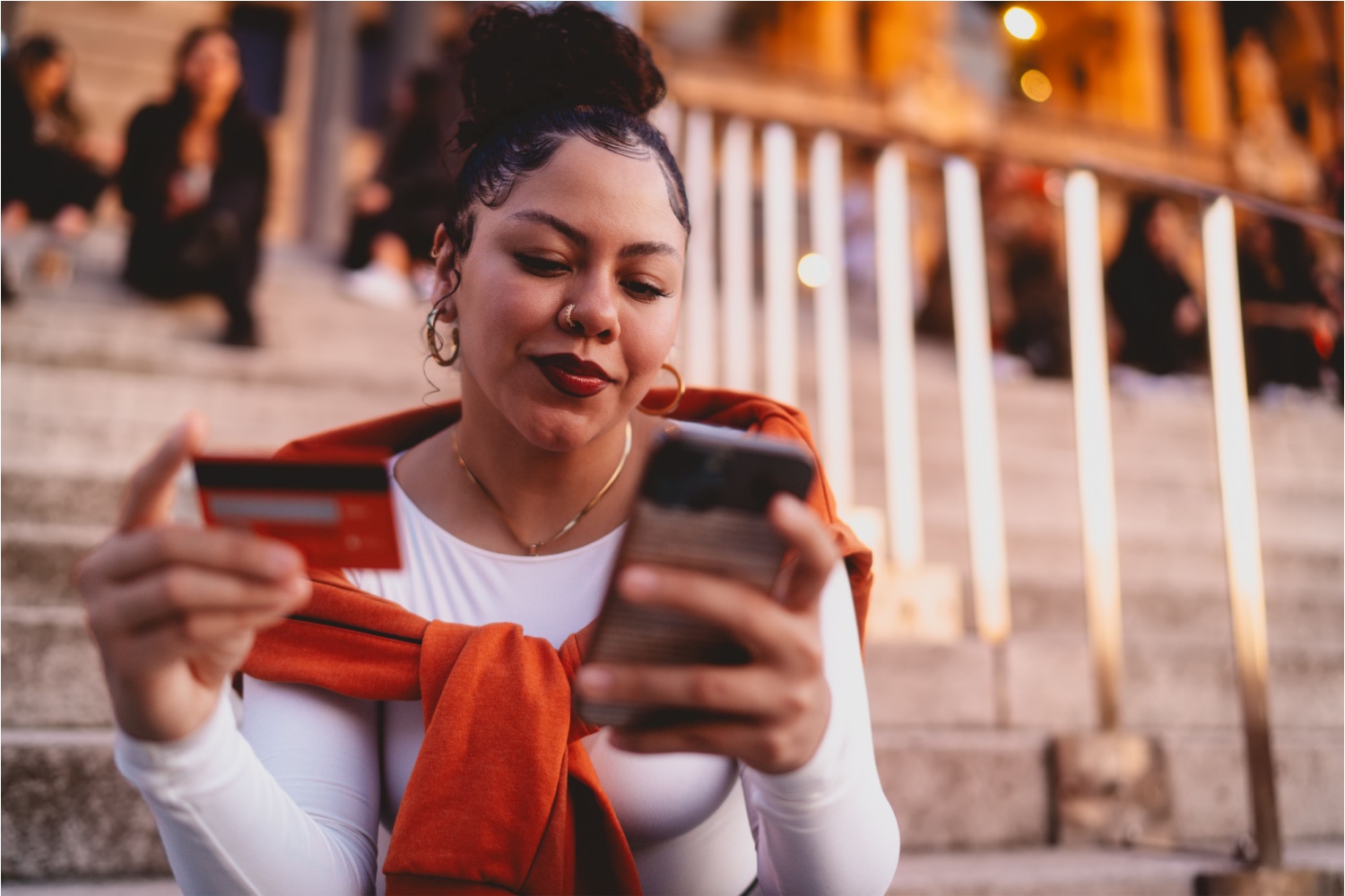 Woman looking at phone with satisfaction