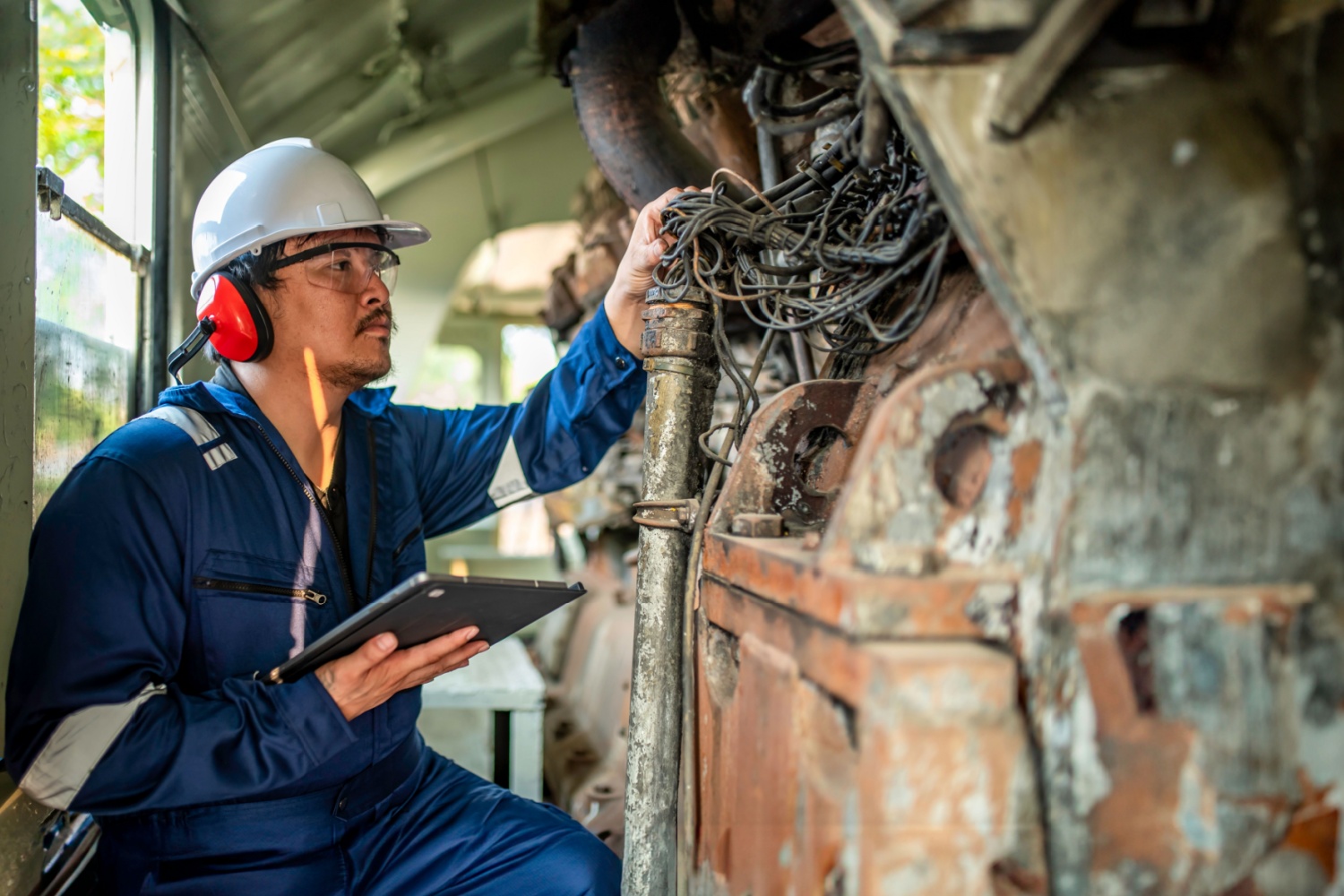 Engineer checking an engine.