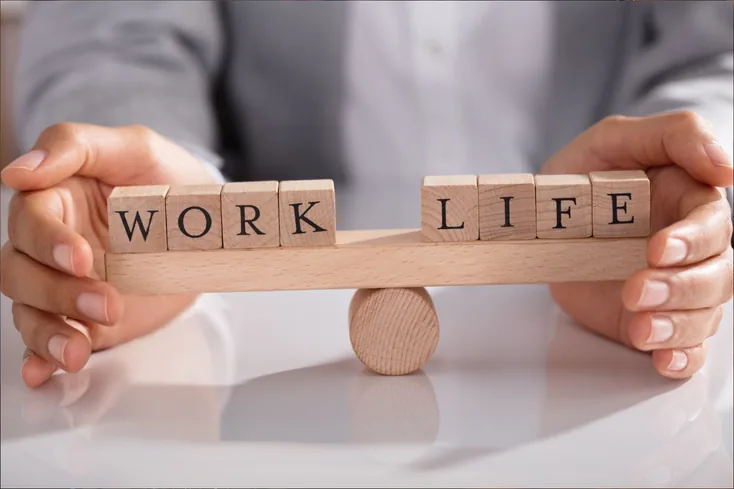 The work / life balance resembled by wooden blocks.