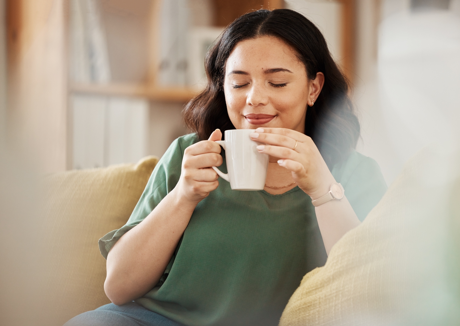 A woman enjoying a quiet cup of tea.